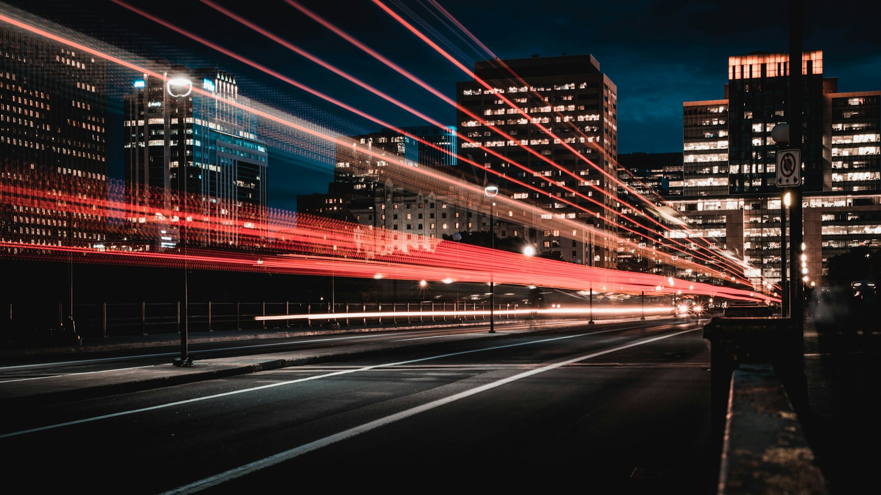Traffic light trails through a city at night
