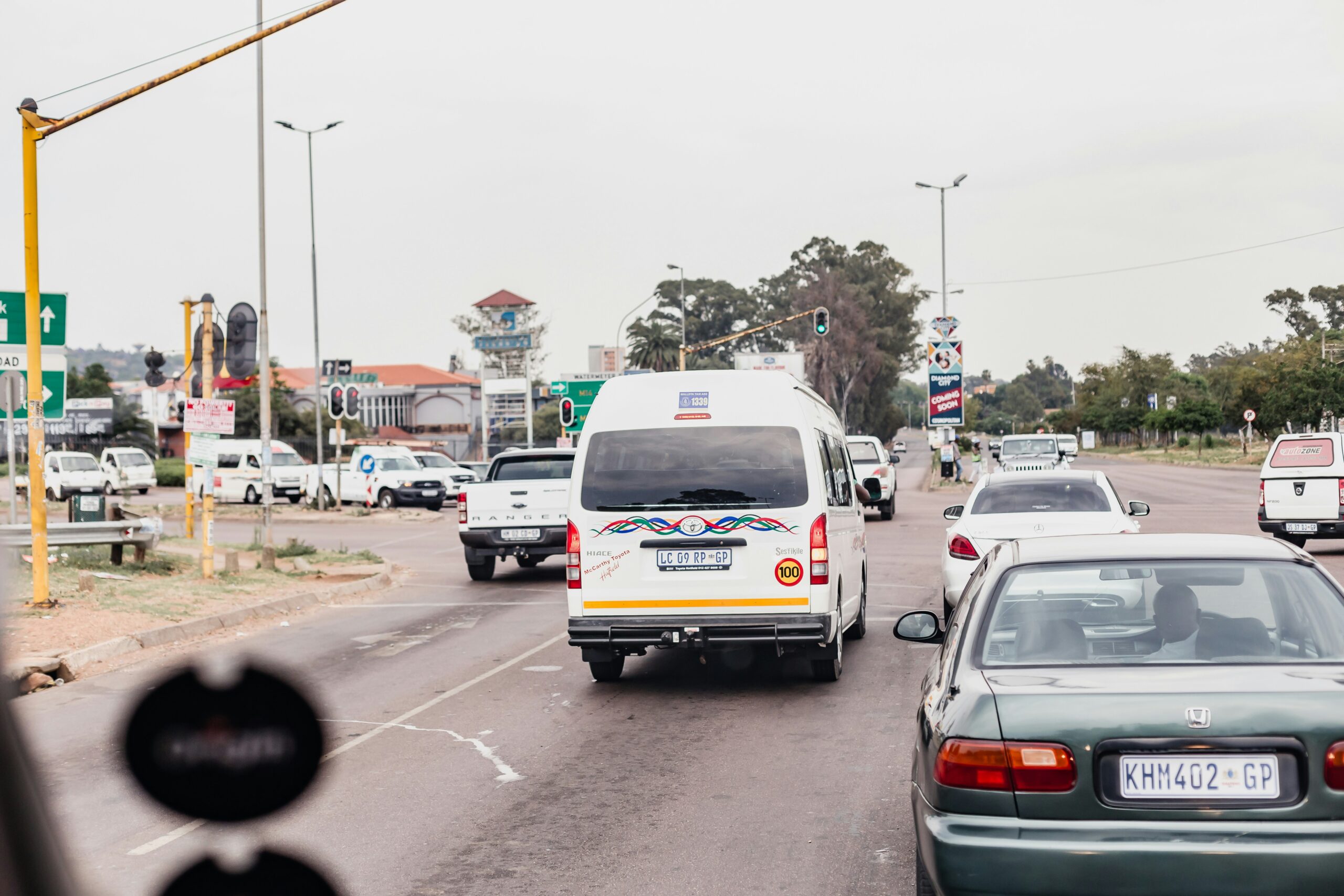 Minibus taxi in mixed traffic on a busy road